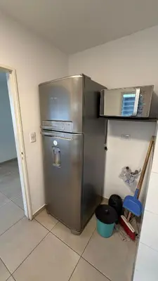 a kitchen with a stainless steel refrigerator and a microwave at Apartment in Córdoba capital in Cordoba
