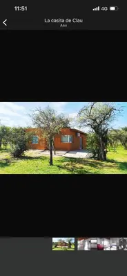 a screenshot of a picture of a house with two trees at La casita de Clau in Los Molles