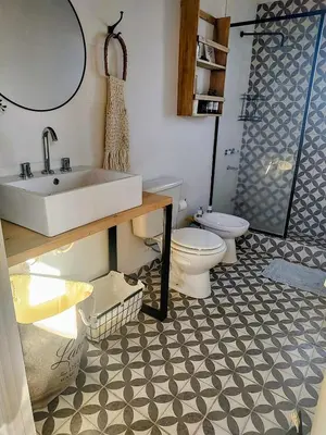 a bathroom with a sink and a toilet at Casa Salvia in Los Hornillos