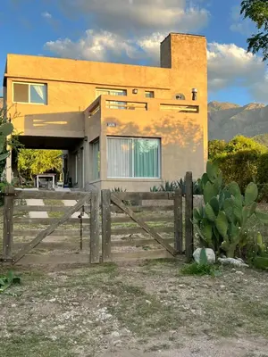 a house with a fence in front of it at Casa Salvia in Los Hornillos