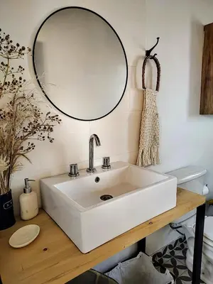 a bathroom with a white sink and a mirror at Casa Salvia in Los Hornillos
