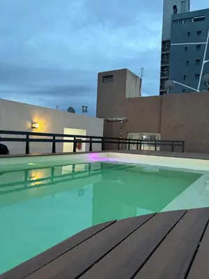 a swimming pool on the roof of a building at Amelia 2-1 in Villa Carlos Paz