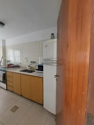 a kitchen with a white refrigerator and a sink at Apartment in Nueva Córdoba for you! in Cordoba