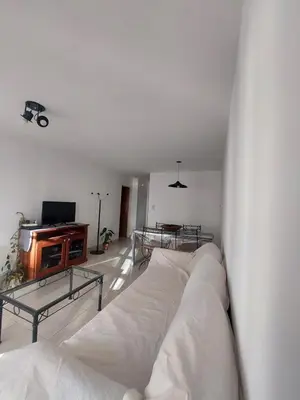 a living room with a white couch and a tv at Apartment in Nueva Córdoba for you! in Cordoba