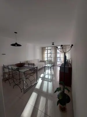 a living room with a table and a couch at Apartment in Nueva Córdoba for you! in Cordoba