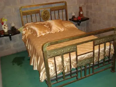 a bed in a room with two side tables at Casa de Campo con Pileta - Estancia La Amistad in Villa Santa Cruz del Lago