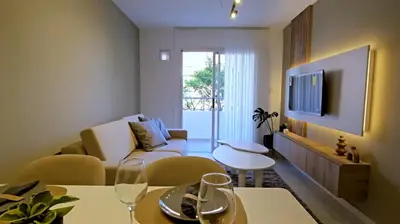 a living room with a couch and a table at Hostel del carlos in Villa Carlos Paz