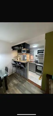 a kitchen with a table and chairs in a room at Vanrod in Cordoba