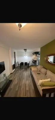 a living room with a couch and a dining room at Vanrod in Cordoba