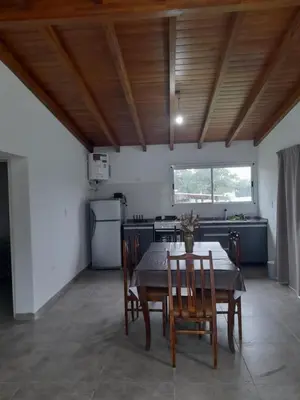 a kitchen with a table and chairs in a room at Casa los nonos in Cordoba