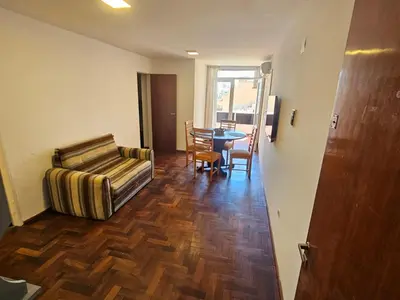 a living room with a couch and a table at Nueva Córdoba 3 personas 1 Dormitorio con Balcón in Cordoba