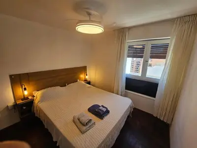 a bedroom with a bed with two towels on it at Nueva Córdoba 3 personas 1 Dormitorio con Balcón in Cordoba