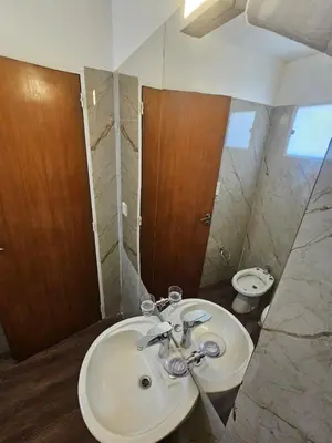 a bathroom with a white sink and a mirror at Nueva Córdoba 3 personas 1 Dormitorio con Balcón in Cordoba