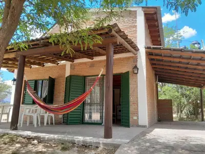 a hammock hanging outside of a house at Bajos de Nono in Nono