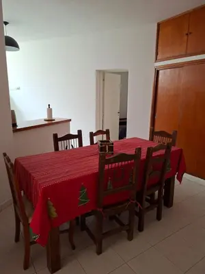 a dining room table with a red table cloth on it at Brothers vcp in Villa Carlos Paz