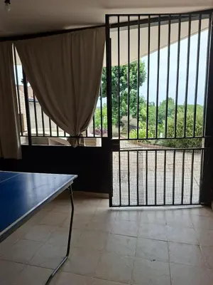a room with a large window with a bench in front at Brothers vcp in Villa Carlos Paz
