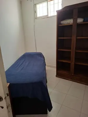 a bedroom with a bed and a book shelf at Brothers vcp in Villa Carlos Paz
