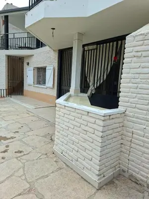 a brick wall with a column on the side of a house at Brothers vcp in Villa Carlos Paz