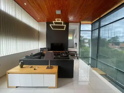 a living room with a couch and a table at Homer Renata Goethe 1197 Villa Carlos Paz, Córdoba in Villa del Lago