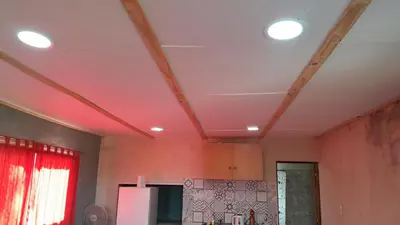 a kitchen with three lights on the ceiling at Monoambiente in Villa Parque Siquiman