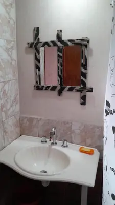 a bathroom with a sink and a mirror at Monoambiente in Villa Parque Siquiman
