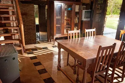 a dining room with a wooden table and chairs at Don Federico in San Javier