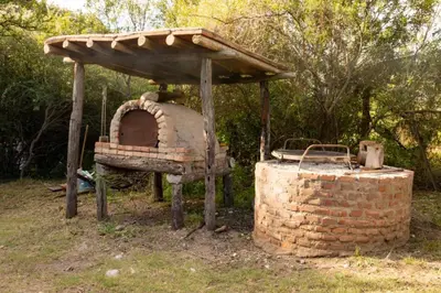 an outdoor oven with a roof on top of it at Don Federico in San Javier