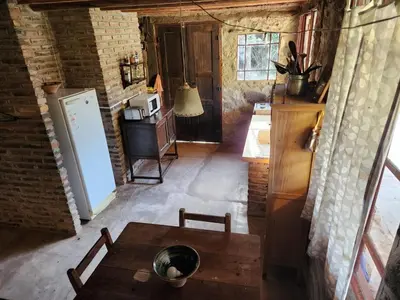 a kitchen with a table and a refrigerator at Don Federico in San Javier