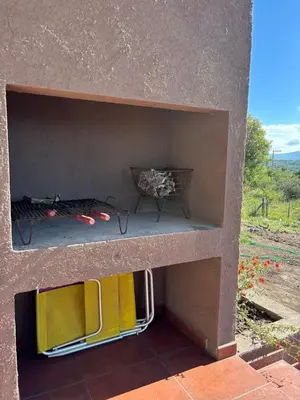 a bunker with a bed and a table and chairs at Green Valley Retreat in Villa General Belgrano