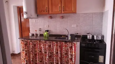 a kitchen with a stove and a counter top at casitadearminda-II in Villa de Las Rosas