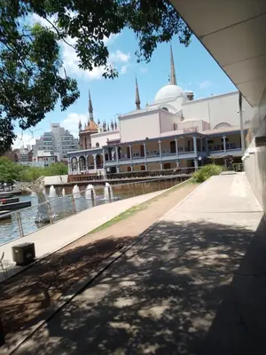 a large white building next to a body of water at Departamento Plaza España in Cordoba