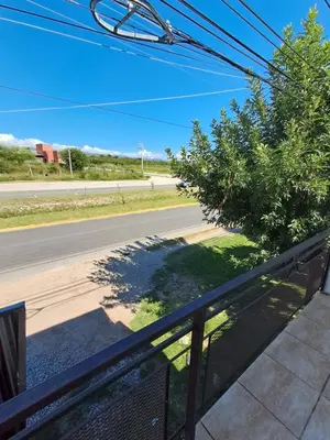 a view of a road from a balcony at Departamento Alta Gracia in Alta Gracia
