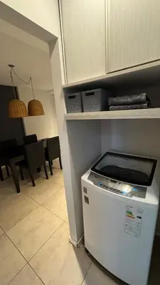 a kitchen with a dishwasher in the corner of a room at Departamento centro Rio Cuarto con Cochera in Río Cuarto