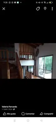 a picture of a room with stairs and a window at Chalet de piedra y madera in Cordoba
