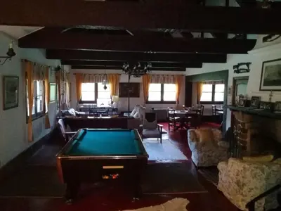 a living room with a pool table in it at Hotel San Huberto Tenis in Nono