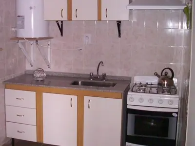 a kitchen with a sink and a stove at La Matilde in Villa Ciudad de America