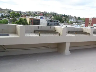 two benches on the roof of a building at Apartamento Edificio Atlantis I in Villa Carlos Paz