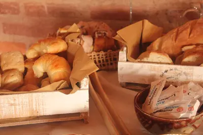 two boxes of different types of croissants and bread at Refugio Del Guira Guira in Los Reartes