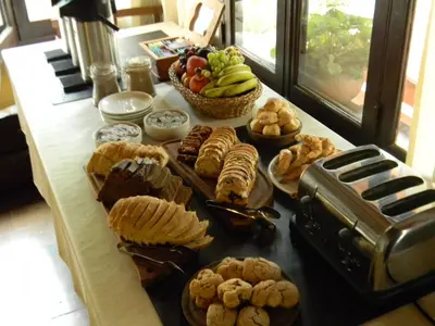 a table topped with lots of different types of food at Las Acacias - Posada de Campo in Villa General Belgrano
