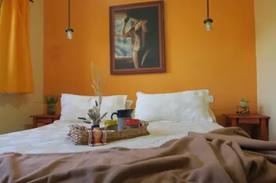 a bedroom with a bed with a basket on it at Cabañas Yanasuy in Merlo