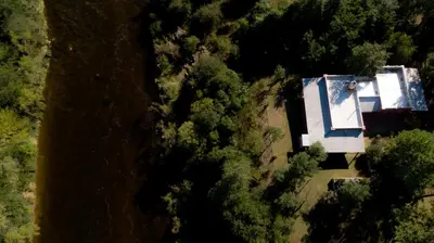 an overhead view of a house in the forest at Cabañas Nueve Lunas in Santa Rosa de Calamuchita