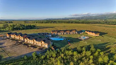 an aerial view of a resort in a field at Blackstone Country Villages Hotel in Villa General Belgrano