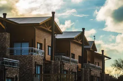 a row of houses with solar panels on them at Blackstone Country Villages Hotel in Villa General Belgrano