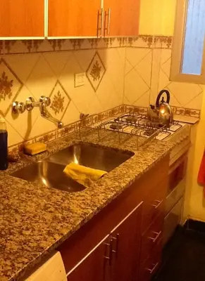 a kitchen sink with a tea kettle on top of it at Nueva Córdoba Rondeau in Cordoba