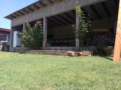 a house with two flowers on the front of it at Casas Cordoba in Villa Parque Siquiman