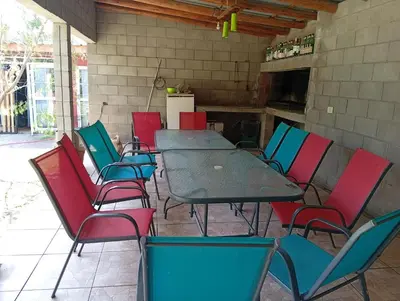a group of chairs and a table in a patio at Casas Cordoba in Villa Parque Siquiman
