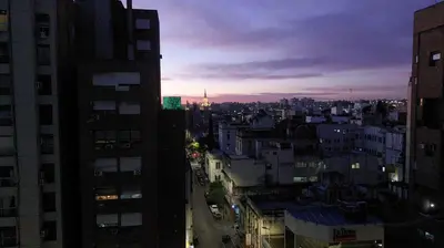a view of a city at night with buildings at Departamento Maipu Cordoba in Cordoba