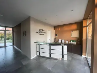 a large kitchen with a counter in a room at Parque Los Nogales Apart Hotel in Merlo