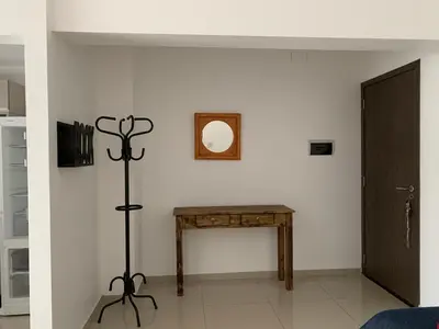 a room with a table and a mirror on the wall at Apartamento 5 Carcano in Villa Carlos Paz