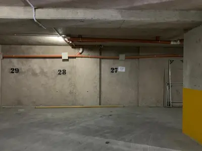 an empty parking garage with pipes on the wall at Apartamento 5 Carcano in Villa Carlos Paz